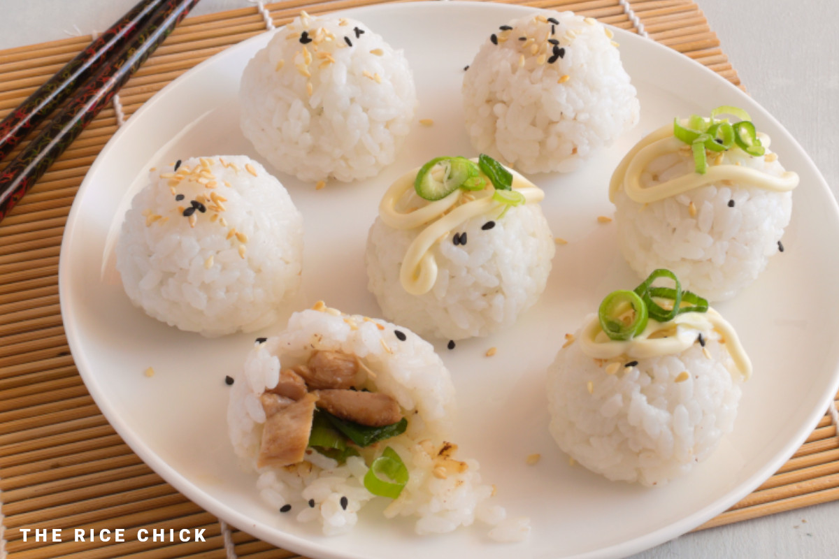 Rice balls filled with chicken on a plate.