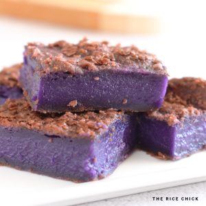 A stack of ube butter mochi pieces.