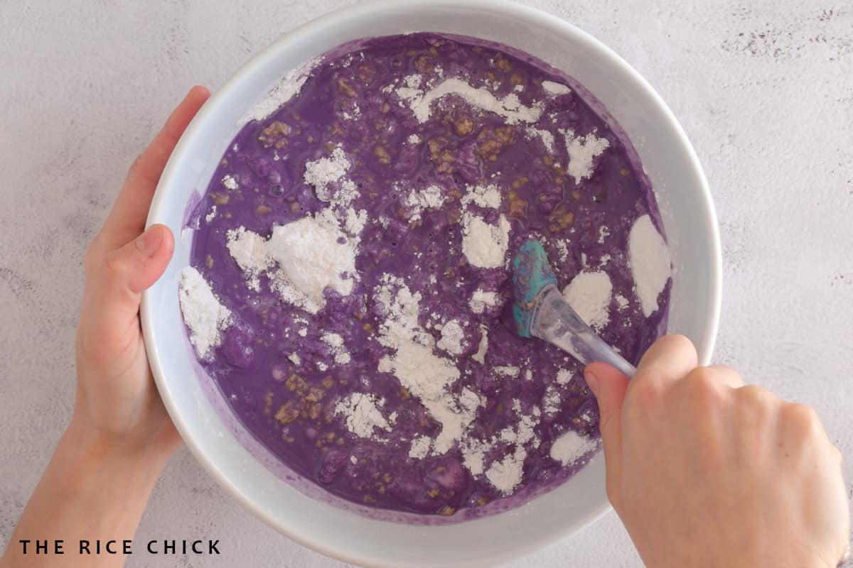 Mixing the ingredients together for ube butter mochi.