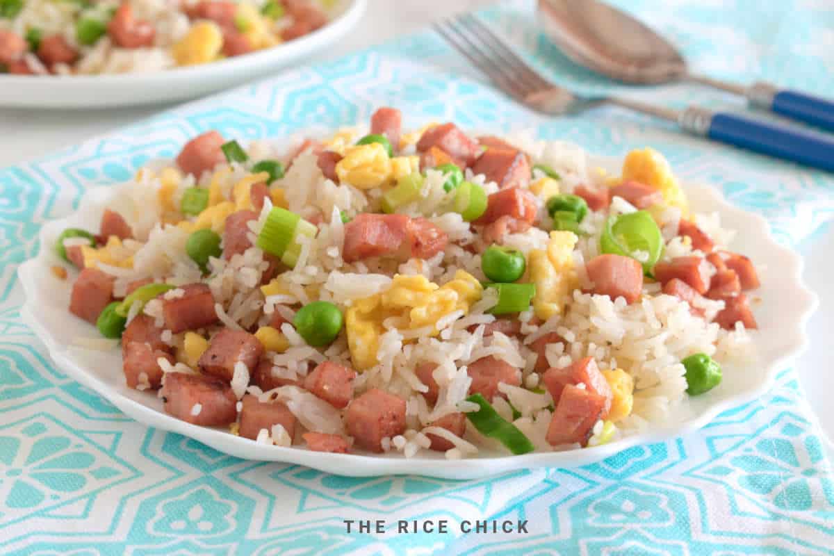 Fried rice on a white plate.