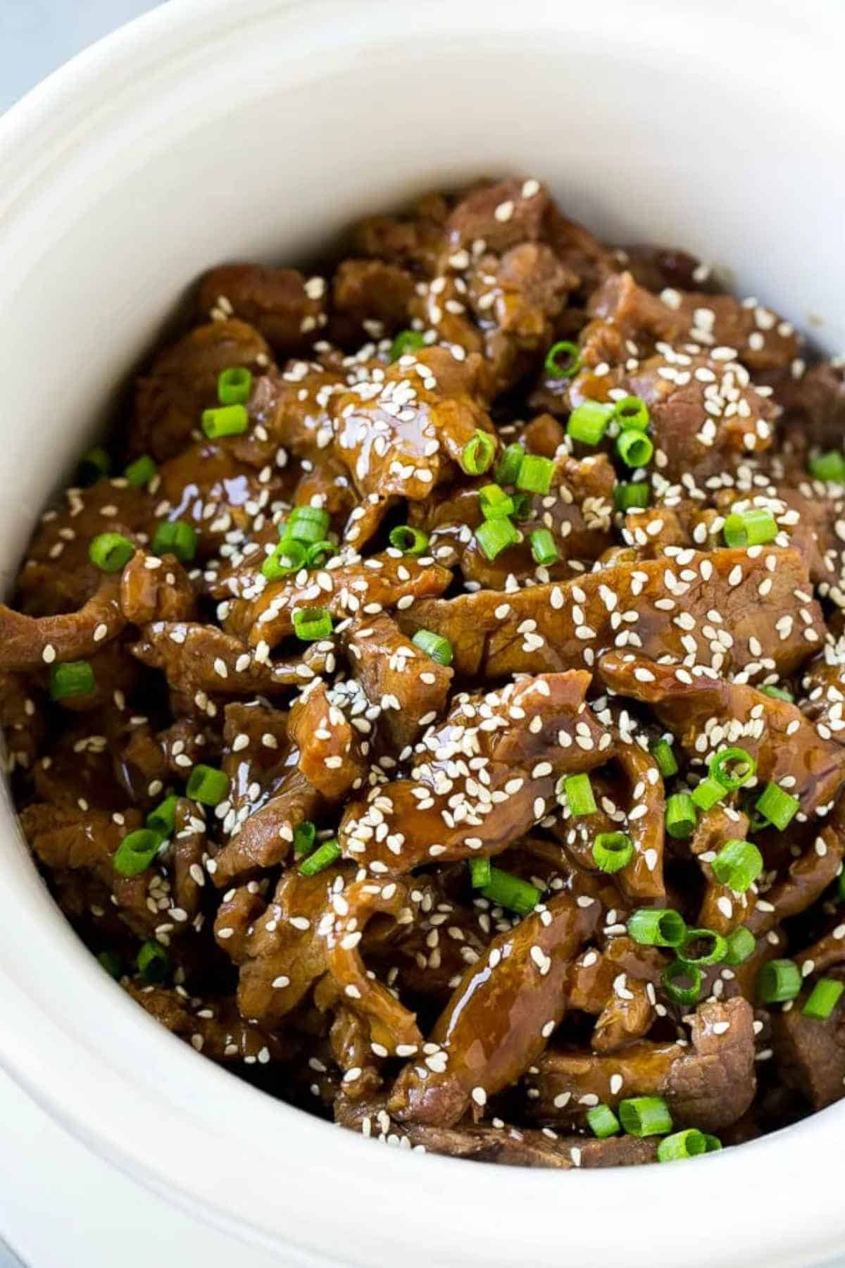 Close up image of slow cooker Korean beef in a bowl.