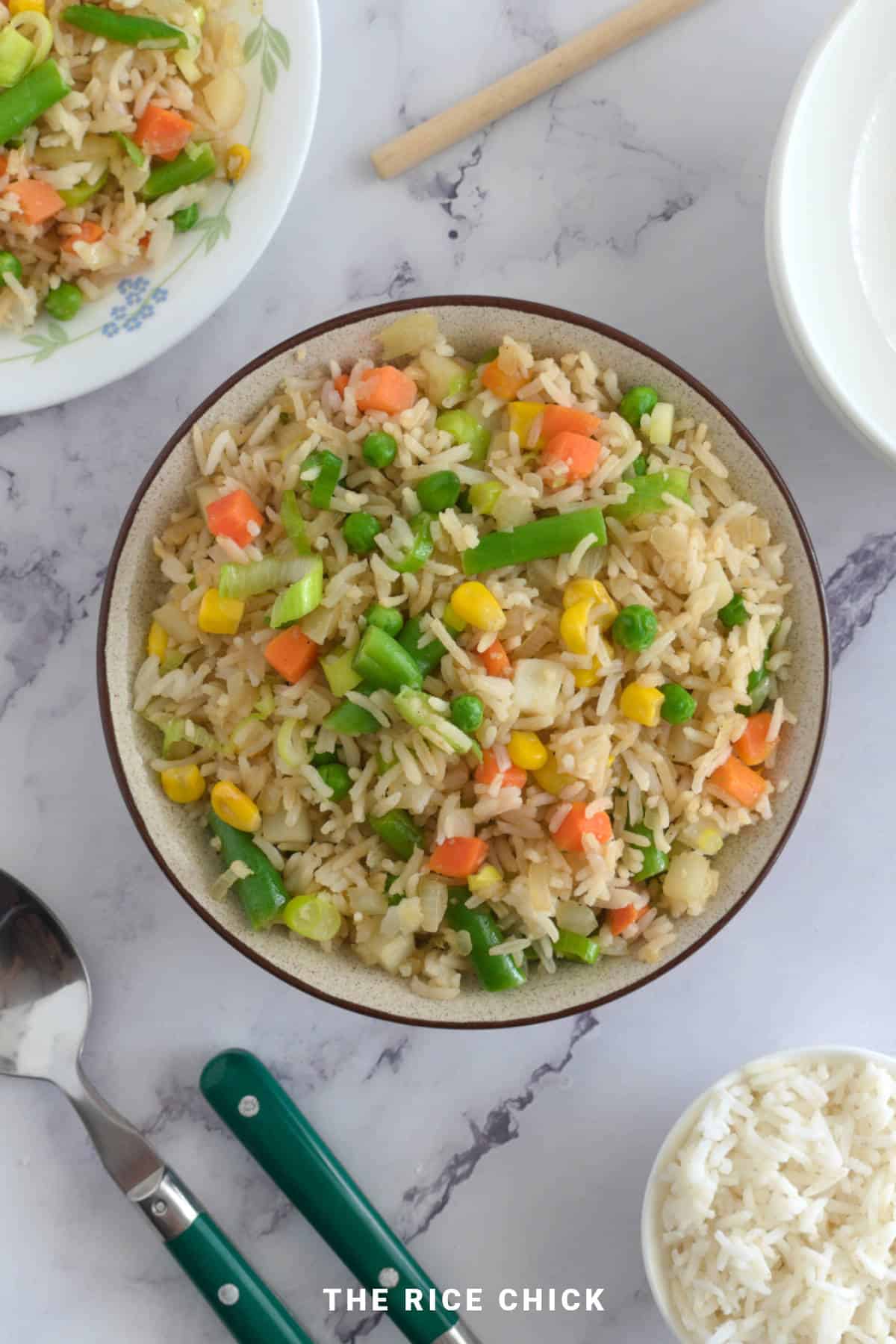 Fried rice with vegetables in a bowl.