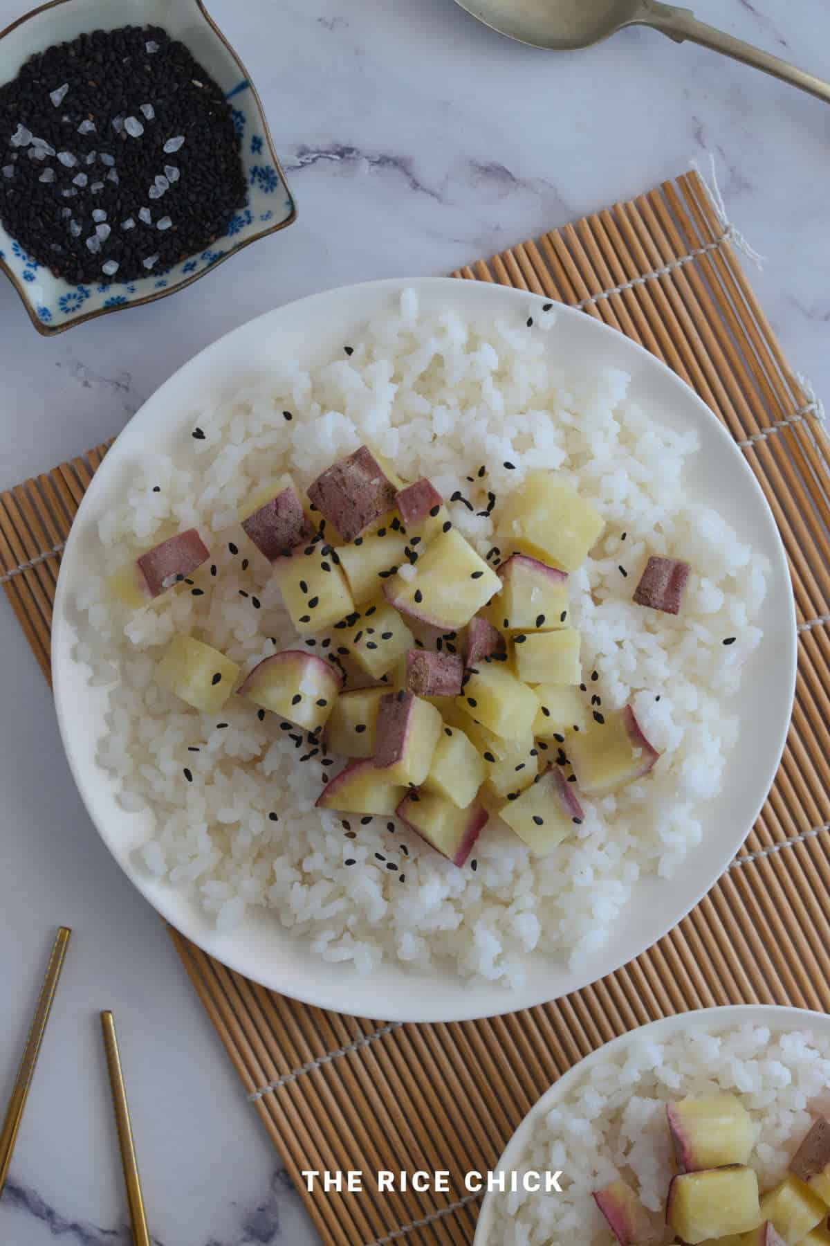 Sweet potato rice with sesame seeds on top.