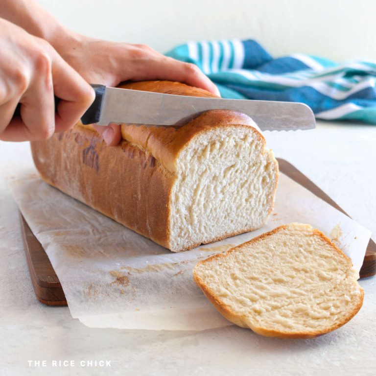 Cutting a loaf of bread.