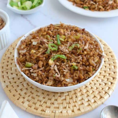Close up image of garlic fried rice in a bowl.