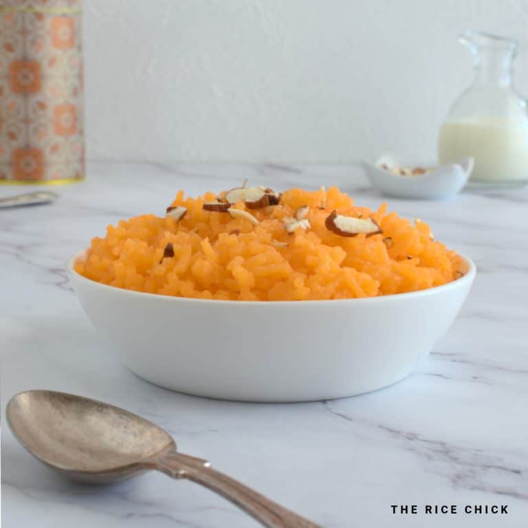 Close up image of orange rice in a bowl.