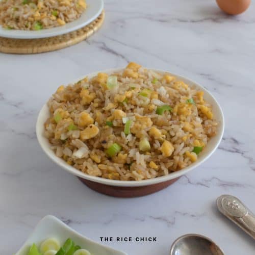 Egg fried rice in a white bowl.