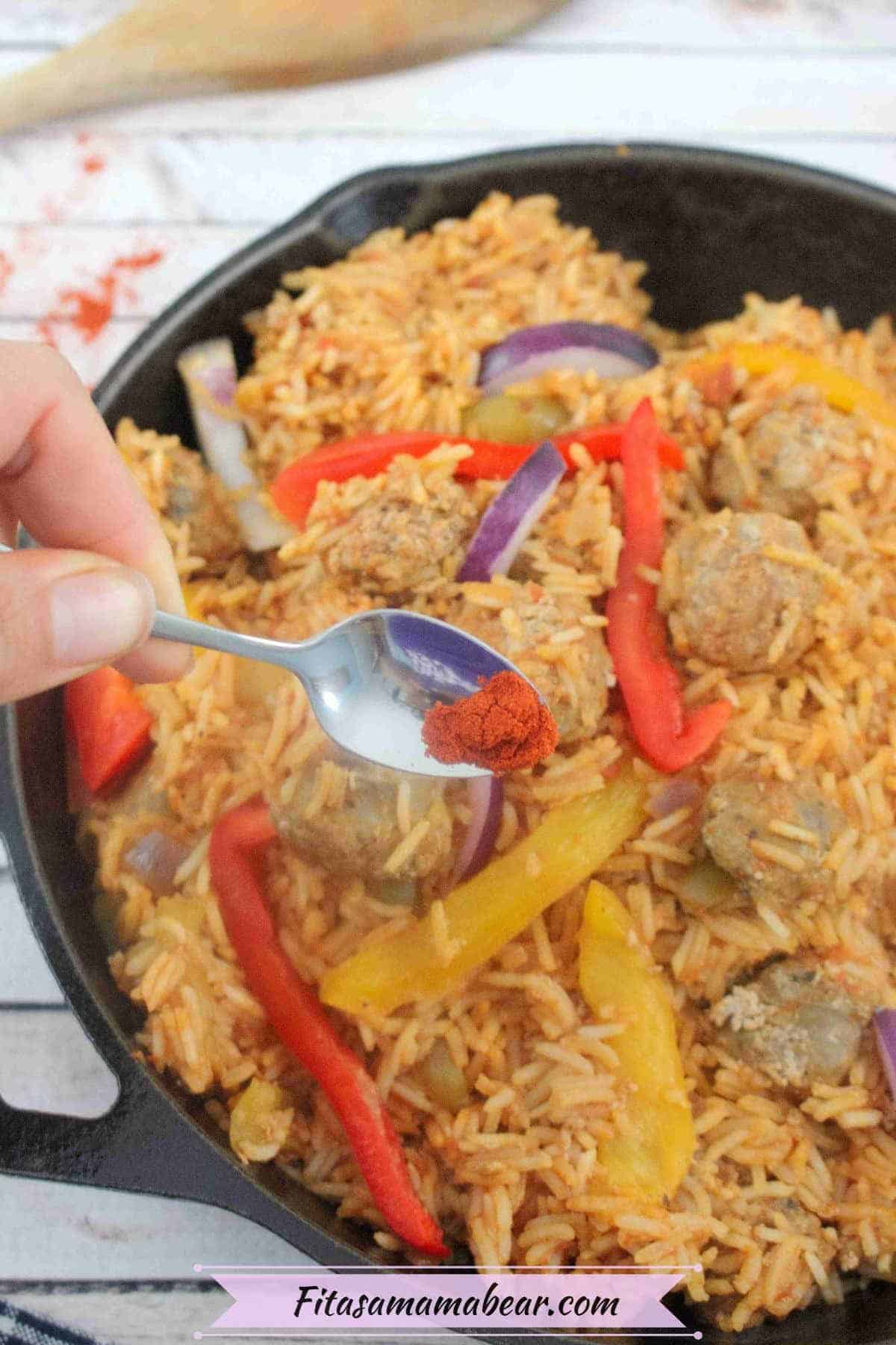 Sausage, rice, and bell peppers in a skillet.